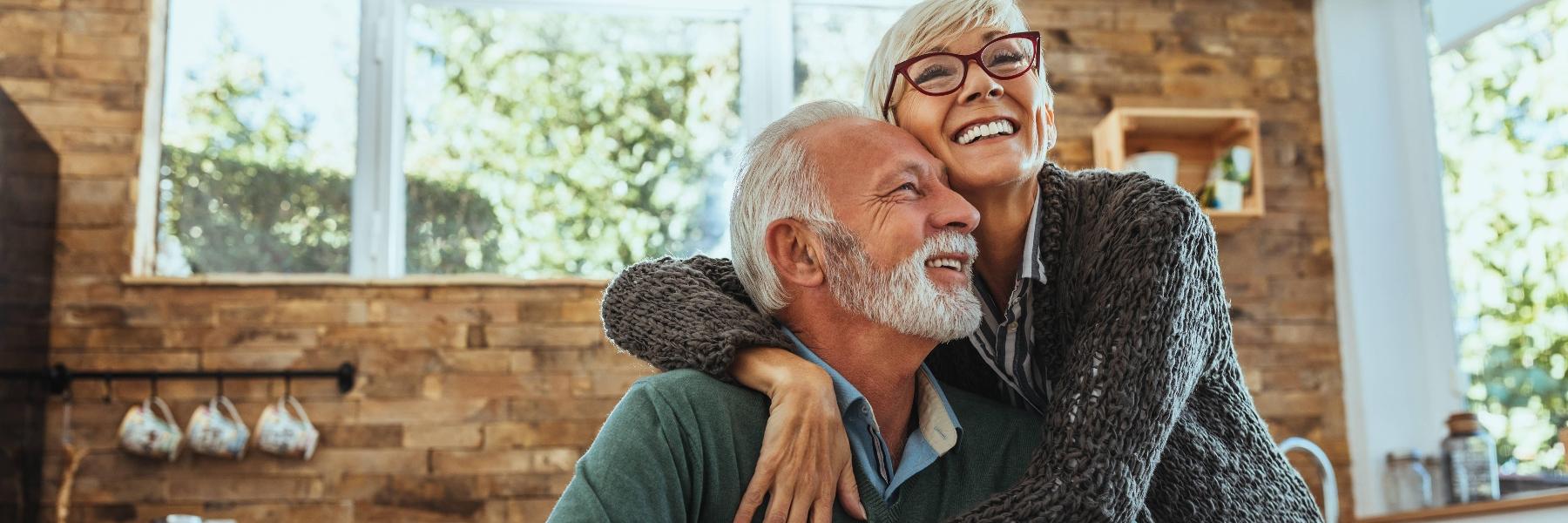 Older couple hugging with dentures in mount waverley
