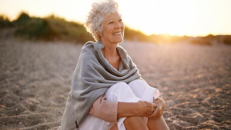 older woman on the beach near mount waverley