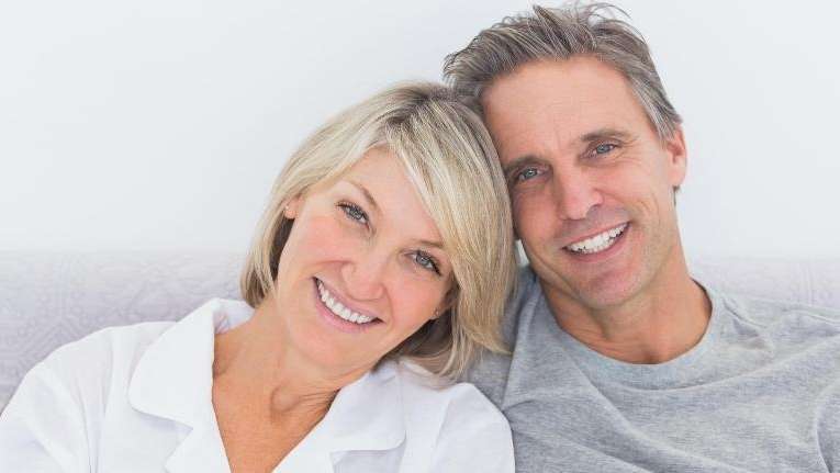 man and woman smiling