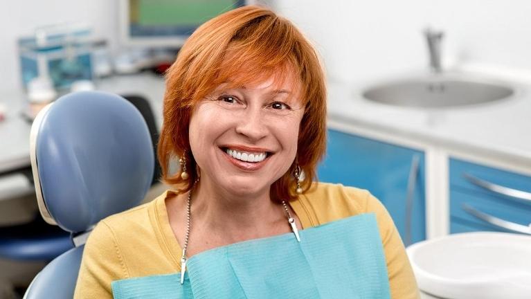 woman with a new dental implant in mount waverley