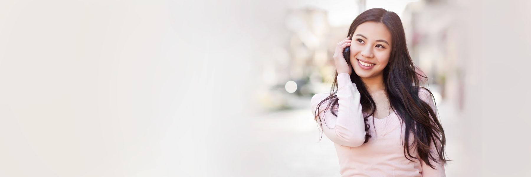 Woman using cell phone outside