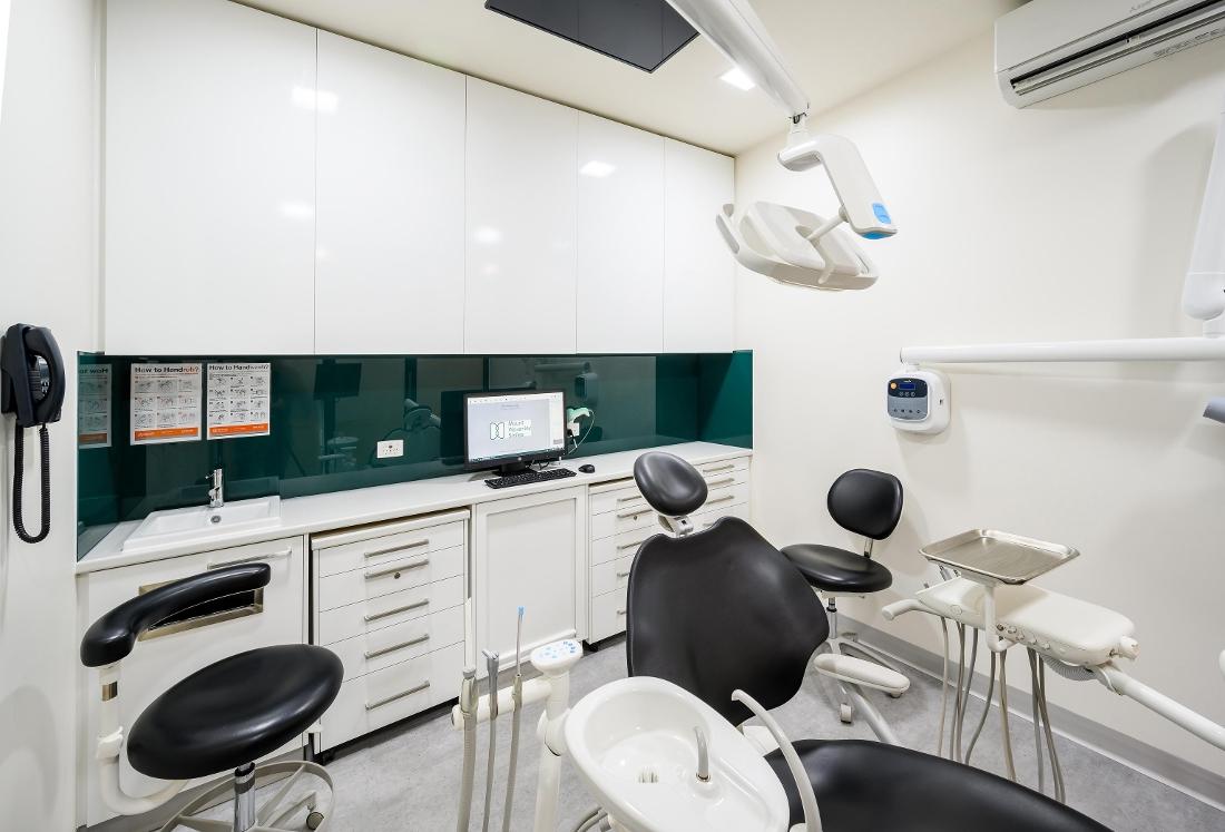 Dental treatment room with chair and lights | Dentist Mount Waverley VIC